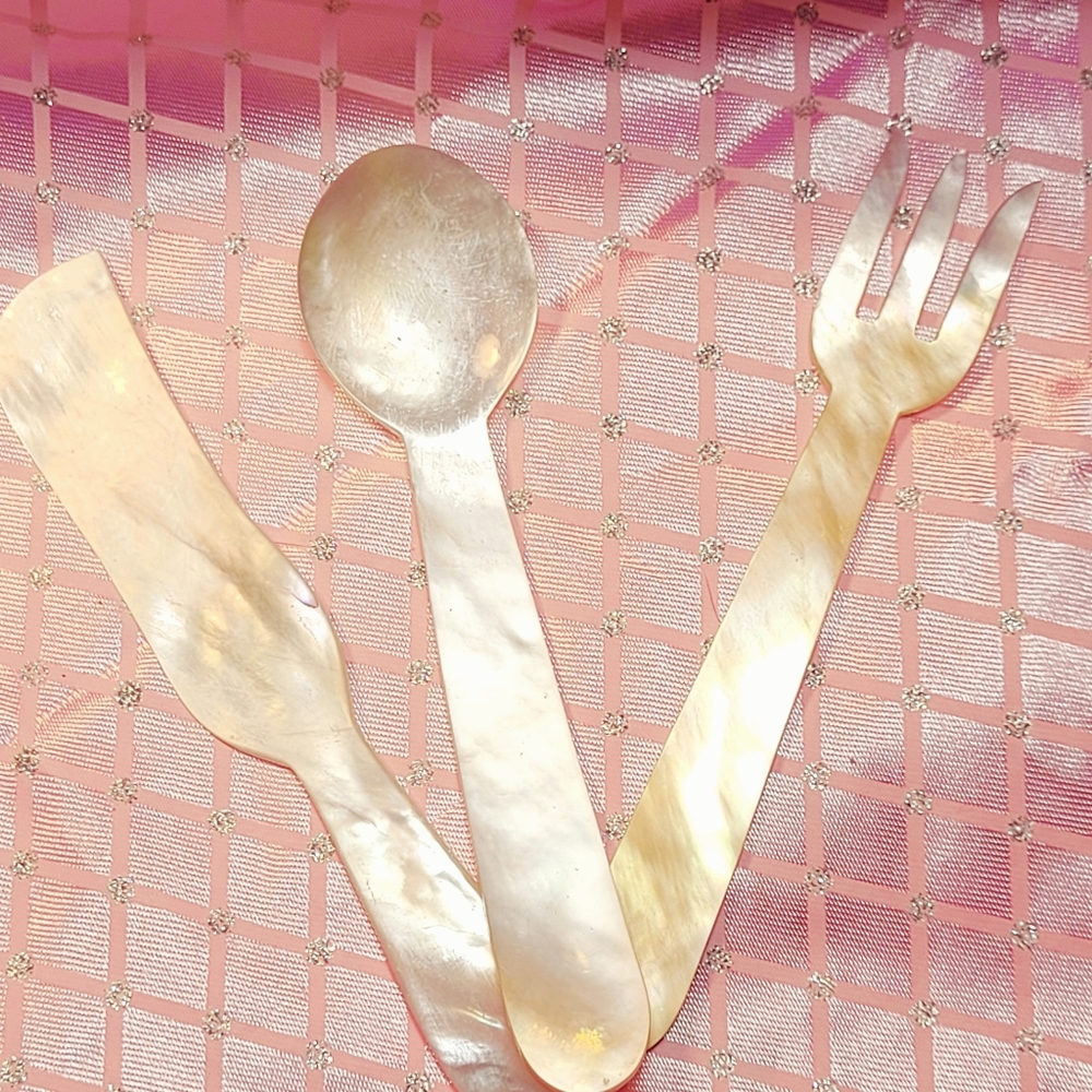 Beautiful mother of pearl appetizer utensils.